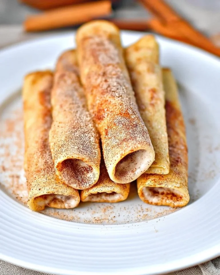 Keto crispy cinnamon cream cheese roll-ups on a plate