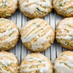 Lemon glazed zucchini cookies on a decorative plate.