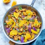 Delicious Orange Chicken stir-fry with colorful vegetables and savory sauce