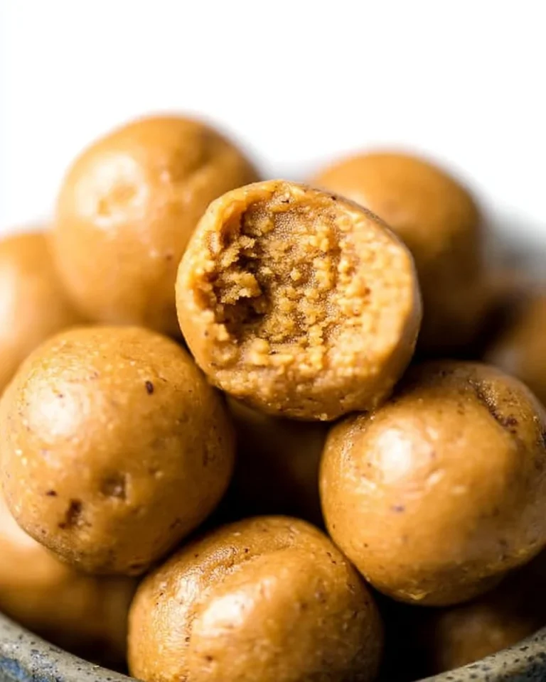 Homemade Peanut Butter Protein Balls on a wooden surface