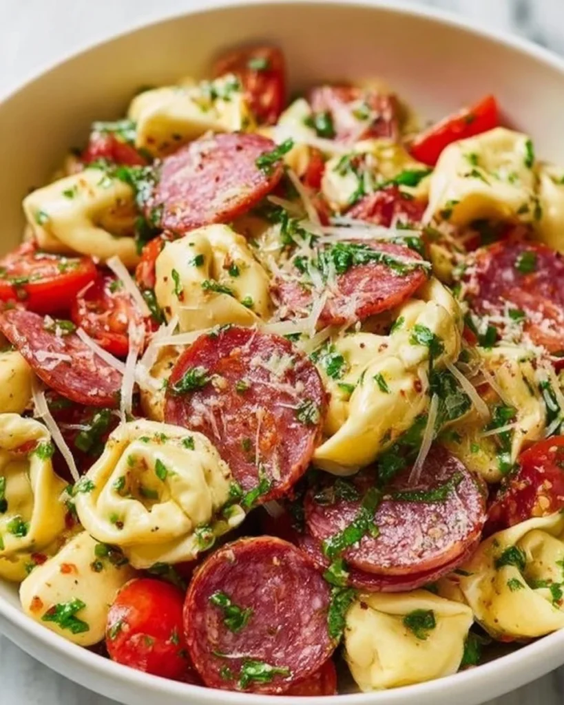 Salami Mozzarella Tortellini Pasta Salad with colorful ingredients