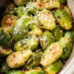 Slow Cooker Parmesan Brussels Sprouts dish garnished and ready to serve