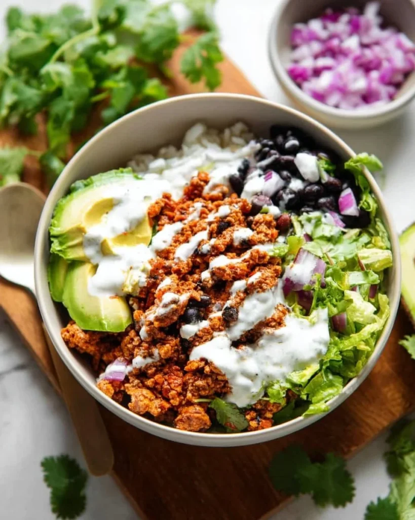 Colorful Sofritas Meal Prep Bowls with beans, rice, and fresh vegetables.