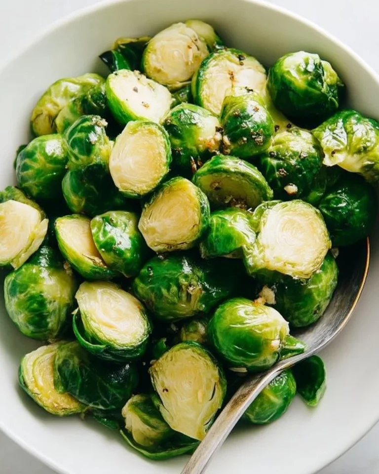 Steamed Brussels sprouts with garlic served on a plate