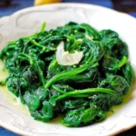 Steamed spinach with garlic and lemon served in a bowl