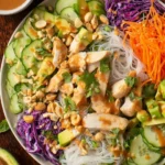 Colorful Chicken Spring Roll Salad with fresh vegetables and herbs