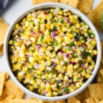 Bowl of homemade copycat Chipotle corn salsa with colorful ingredients