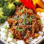 Delicious Crockpot Teriyaki Chicken served with rice and vegetables
