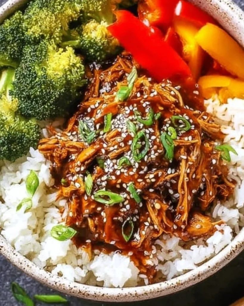 Delicious Crockpot Teriyaki Chicken served with rice and vegetables