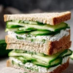 Fresh cucumber sandwiches on a platter, perfect for tea time or summer gatherings.