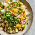 Fresh snapper ceviche served in a bowl with garnish