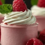 Fresh Raspberry Cloud Mousse topped with raspberries and mint leaves