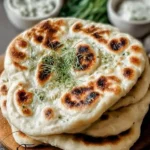 Freshly baked Greek Pita Bread served with dips and fillings