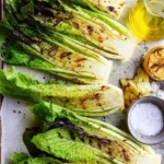 Delicious grilled romaine salad with cherry tomatoes and parmesan cheese