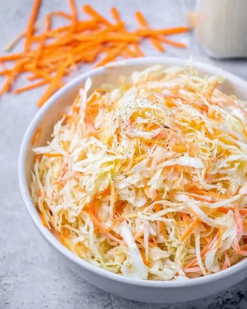 Bowl of homemade coleslaw salad with fresh cabbage and dressing