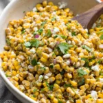 Bowl of vibrant Mexican street corn salad with fresh ingredients