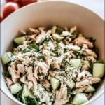 Delicious bowl of rotisserie chicken salad with fresh vegetables