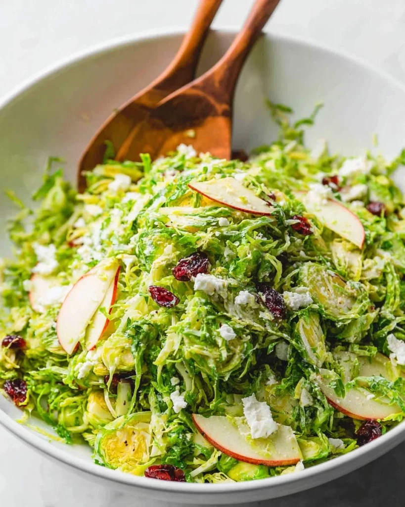 Fresh Shaved Brussels Sprout Salad with almonds and lemon dressing