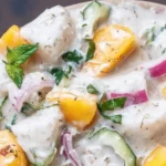 Bowl of Tropical Coconut Milk Ceviche with fresh seafood and herbs