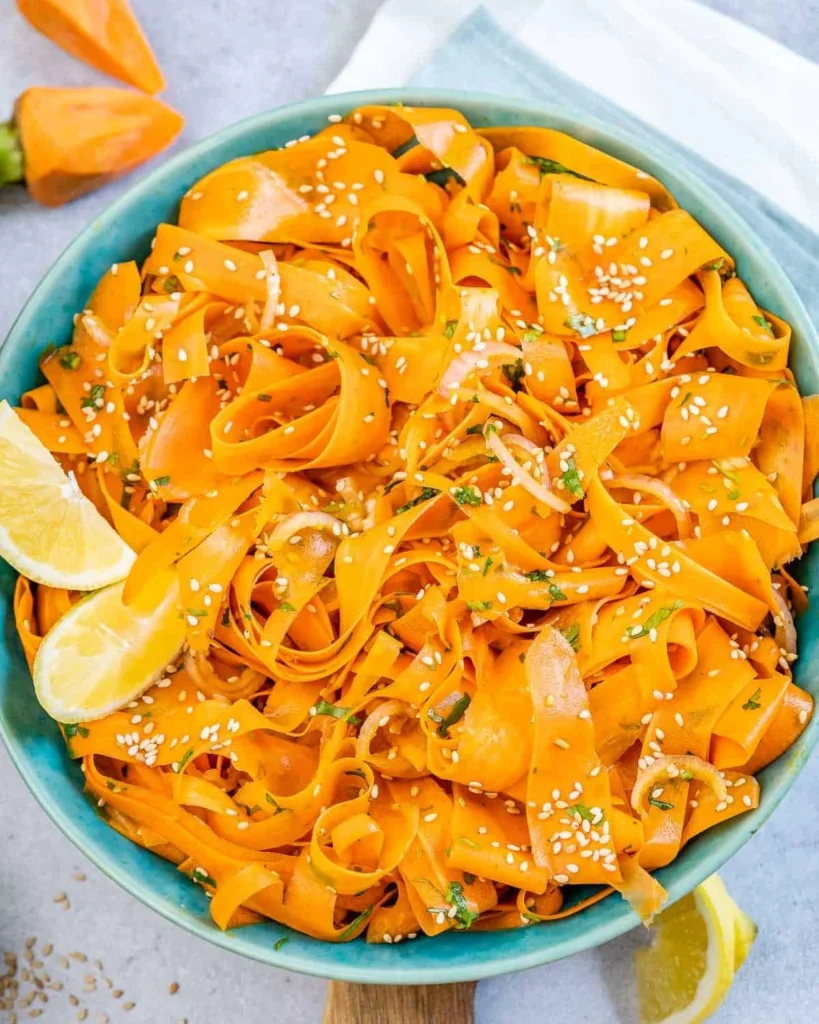Viral carrot salad with fresh ingredients and a colorful presentation.