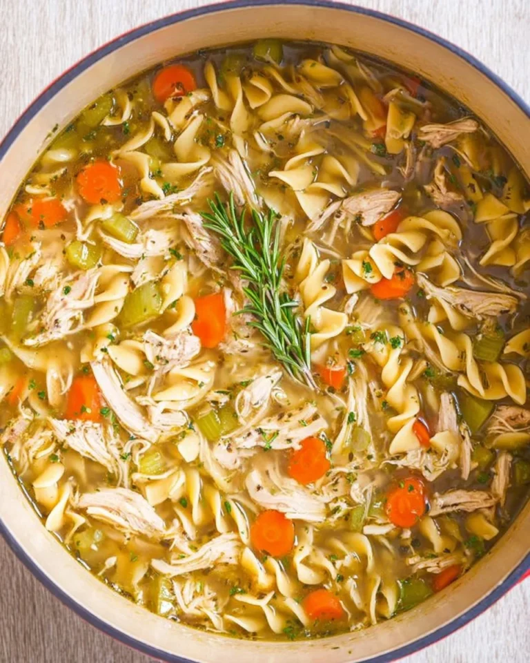 Bowl of 30-minute leftover turkey noodle soup with fresh herbs