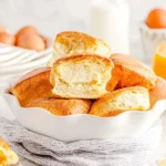 Freshly baked Angel Biscuits on a wooden table