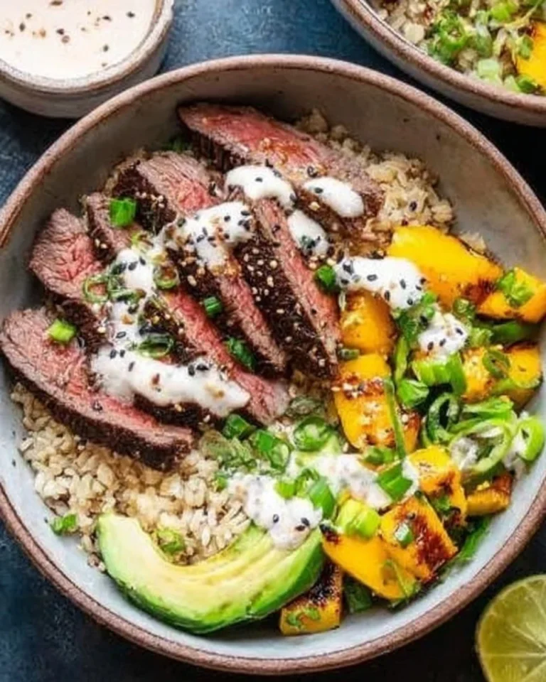A colorful Asian Steak Bowl with tender beef, vegetables, and rice.
