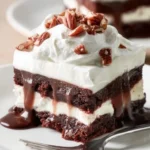 Decadent Brownie Delight topped with chocolate drizzle and nuts