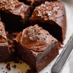 Delicious homemade chocolate snack cake topped with chocolate frosting