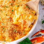 Delicious Crab Macaroni and Cheese garnished with herbs in a creamy sauce
