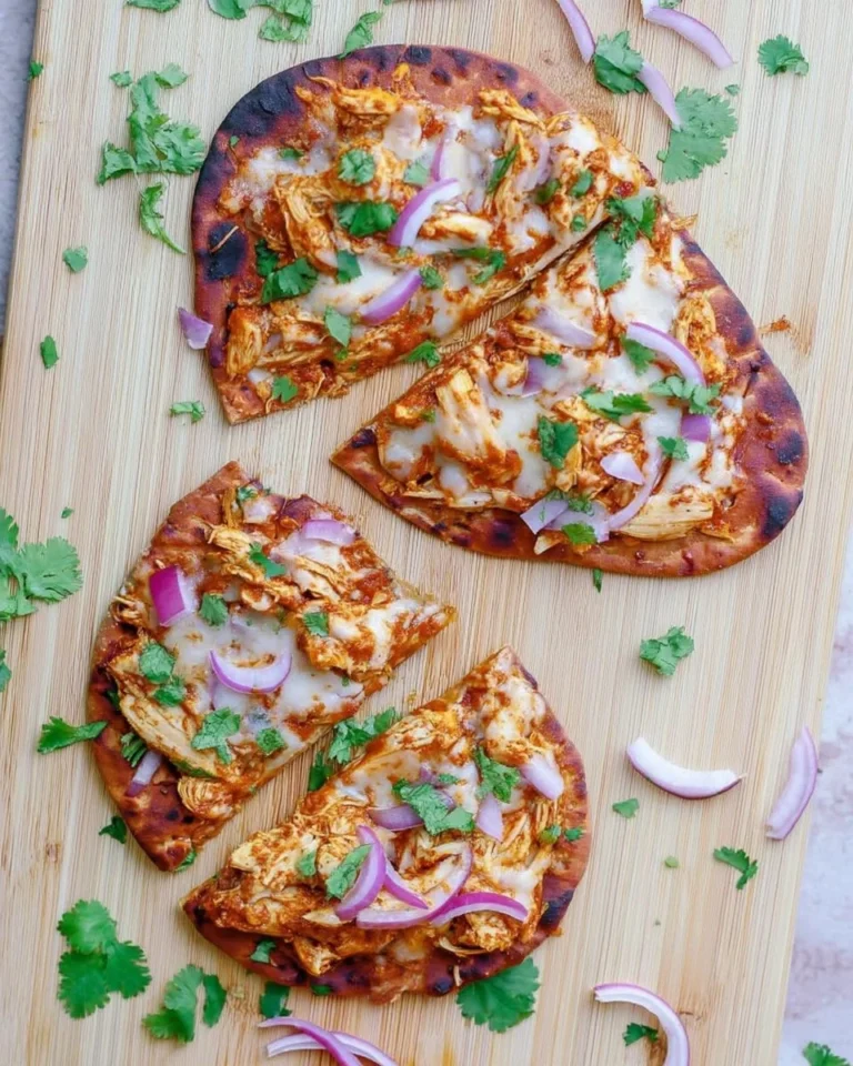Delicious BBQ chicken naan pizza topped with fresh ingredients