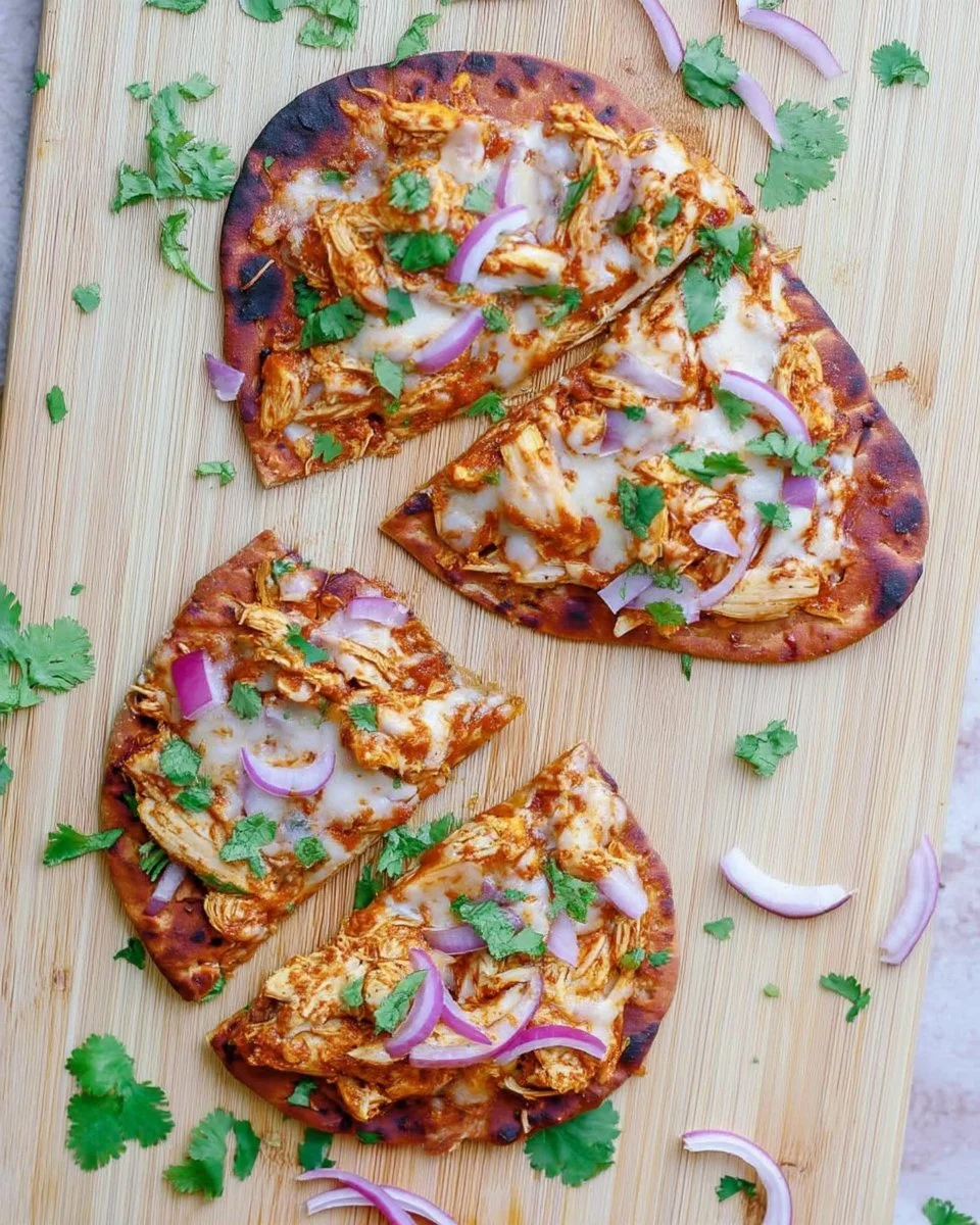 Delicious BBQ chicken naan pizza topped with fresh ingredients
