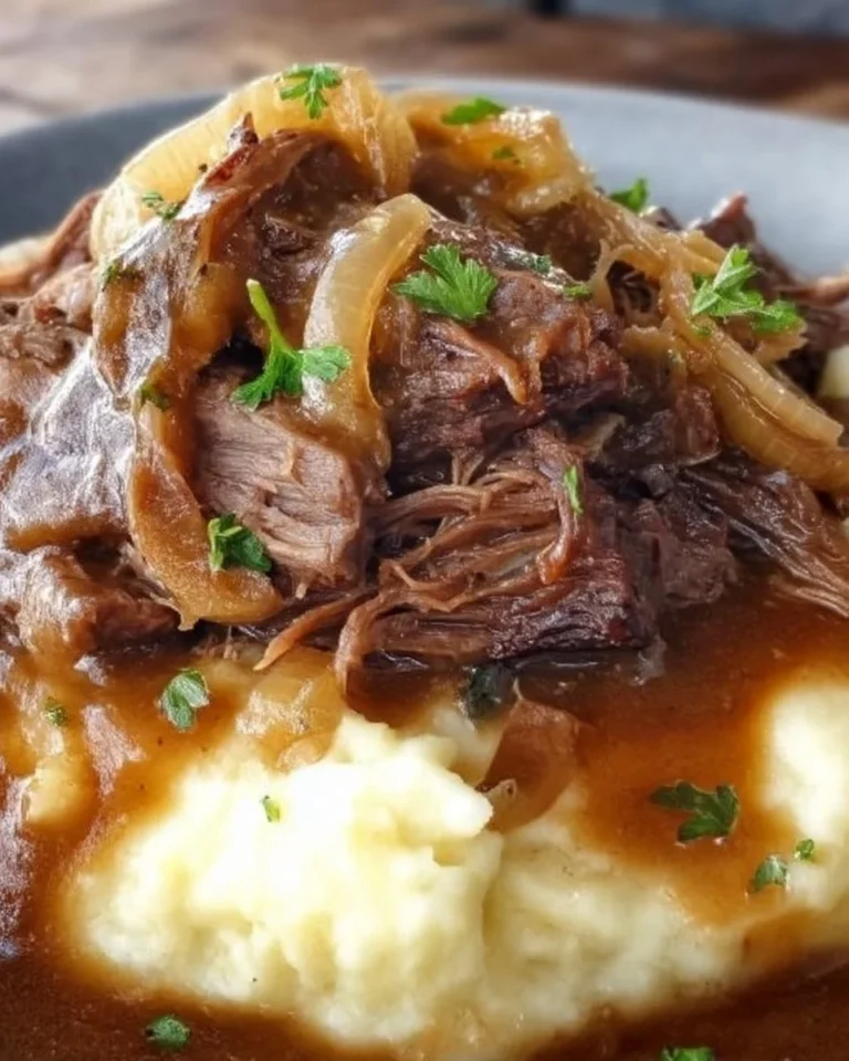 Delicious French Onion Pot Roast served with caramelized onions and herbs
