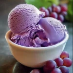 Delicious grape juice ice cream in a bowl with fresh grapes