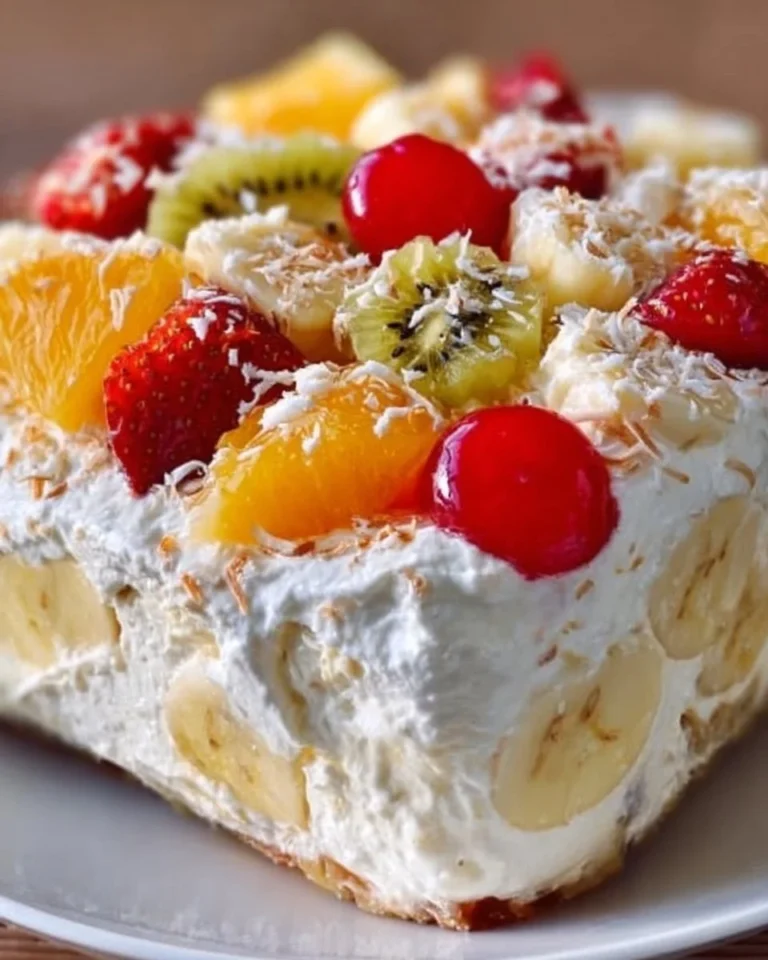 Delicious Hawaiian Cheesecake Salad topped with tropical fruits.