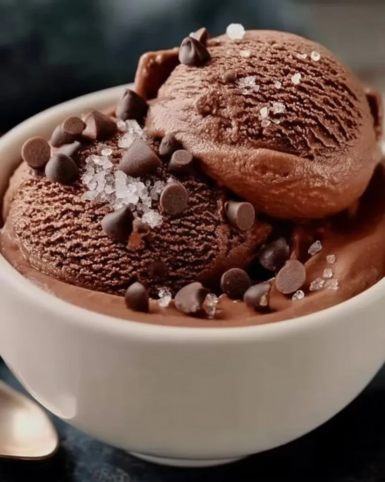 Bowl of high protein chocolate cottage cheese ice cream topped with chocolate shavings