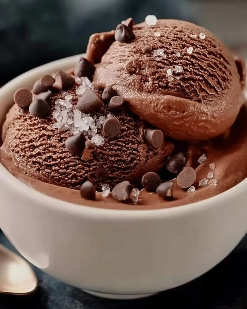 Bowl of high protein chocolate cottage cheese ice cream topped with chocolate shavings