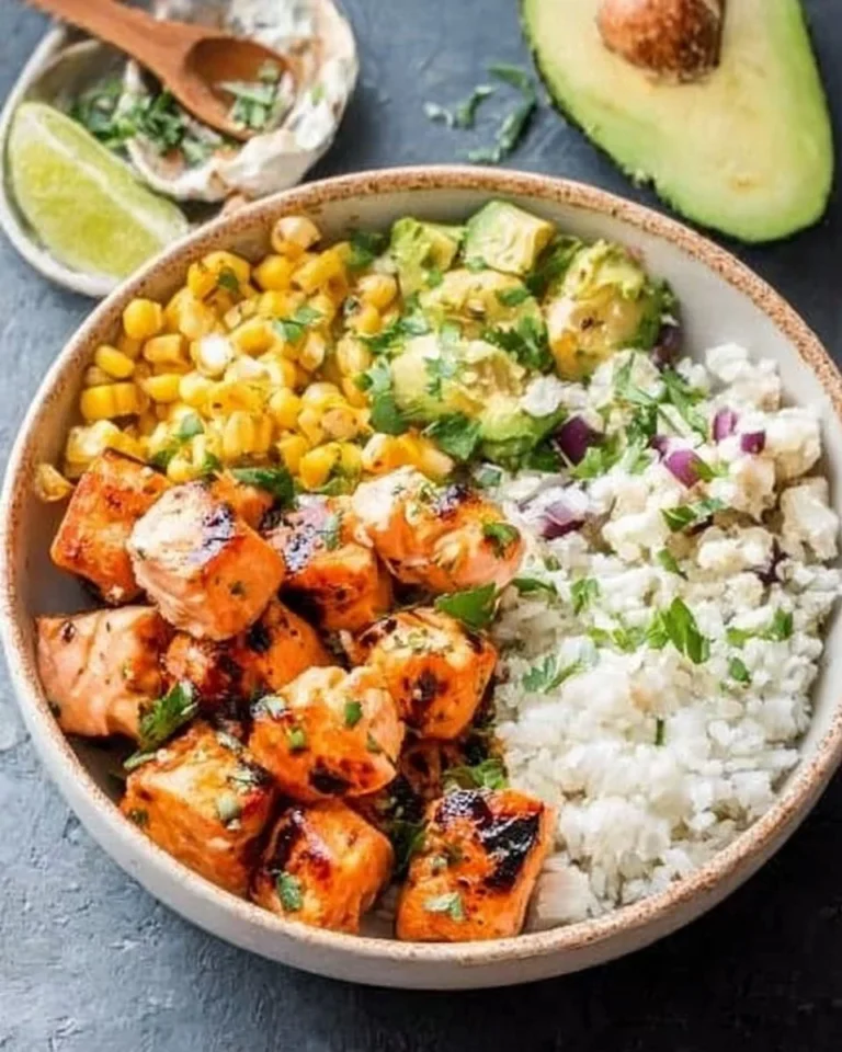 Delicious bowl of Honey Chipotle Salmon served with fresh vegetables and grains