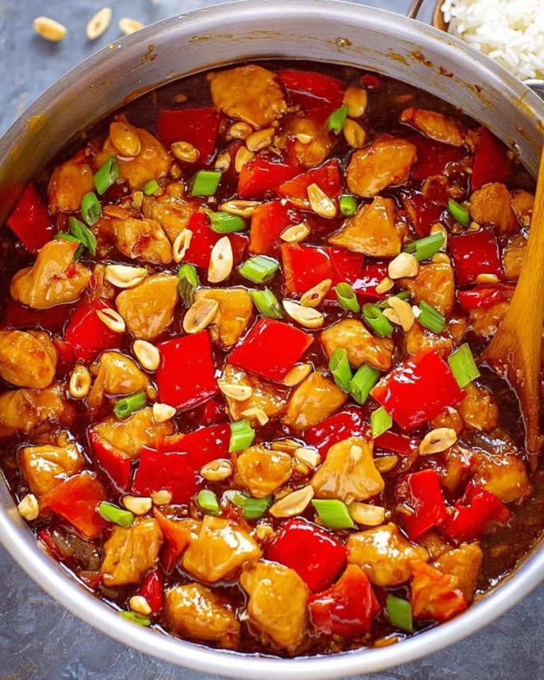Delicious plate of Kung Pao Chicken with chicken, peanuts, and vegetables.