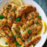 Lemon Butter Chicken Tenders served with a side of vegetables