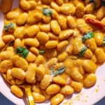 Delicious bowl of Marry Me Butter Beans garnished with herbs