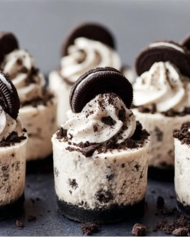 Mini No-Bake Oreo Cheesecakes topped with Oreo cookie crumbles