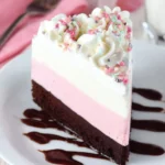 Slice of Neapolitan Ice Cream Cake showcasing chocolate, vanilla, and strawberry layers