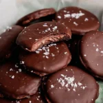 No Bake Thin Mint Cookies on a plate with mint leaves and chocolate drizzle