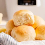 Homemade no-knead slow cooker dinner rolls, fluffy and golden brown.