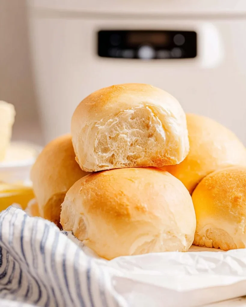 Homemade no-knead slow cooker dinner rolls, fluffy and golden brown.