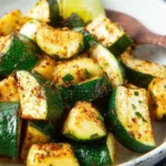 Delicious oven roasted zucchini slices, seasoned and cooked to perfection