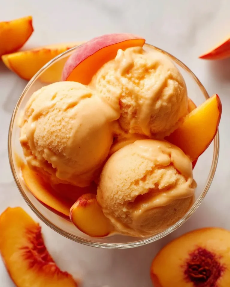 Delicious Peach Greek Yogurt in a bowl topped with fresh peach slices