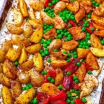 Sheet pan curry chicken with colorful vegetables ready to be served