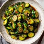 Bowl of spicy cucumber salad with fresh ingredients